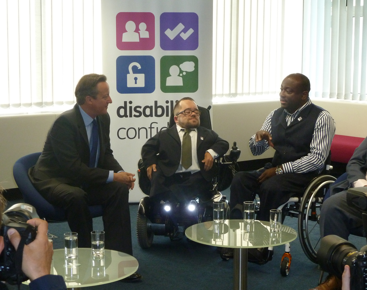 Mark Esho (right) talks to Prime Minister David Cameron at the Disability Confidence campaign conference