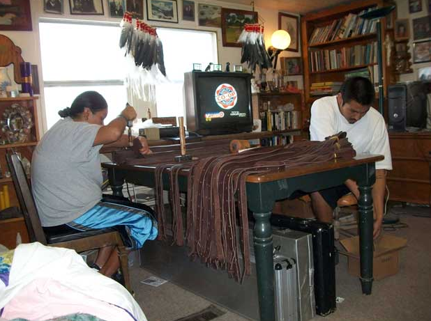 Lakota craftspeople making bison leather banjo straps