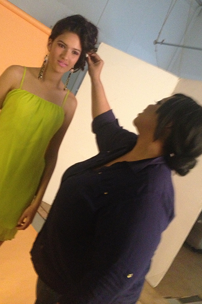 Tashonda Brown touching up Tasia's hair on set