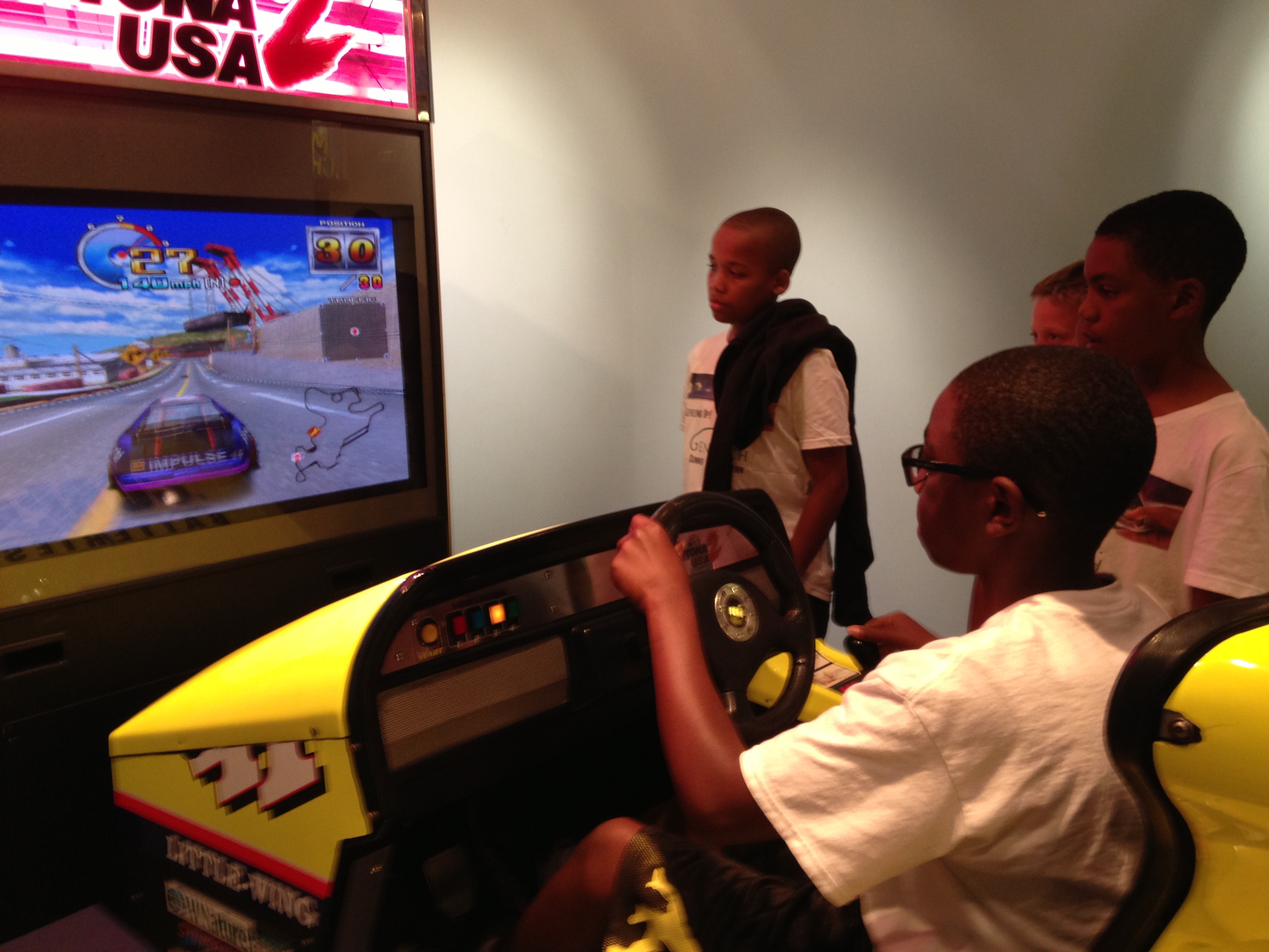 Campers apply the principles of aerodynamics  in these racing car simulators.