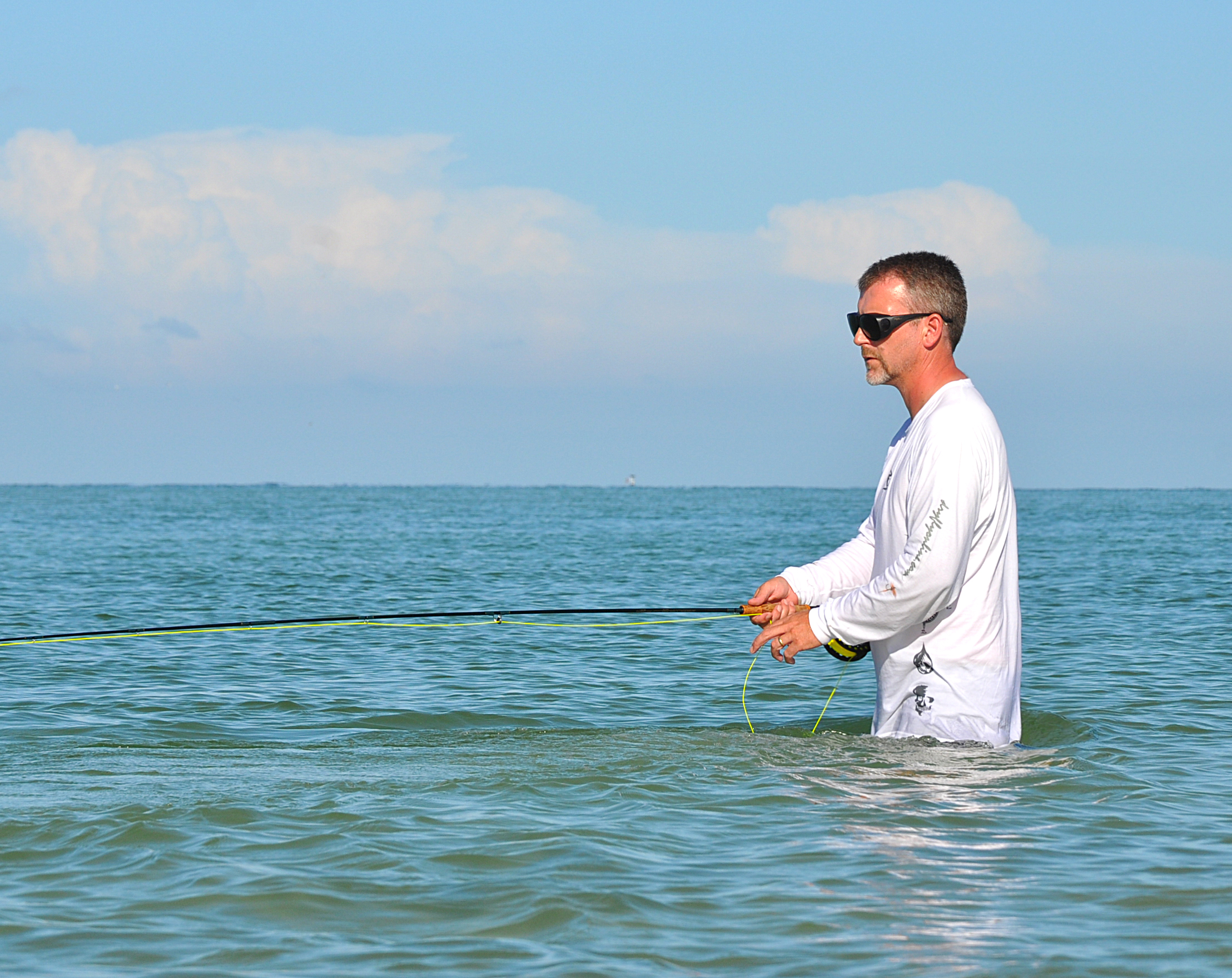 DryFlyOnline CEO and co-founder Paul Griffiths sight fly casting Tarpon in Big Pass, Sarasota, FL