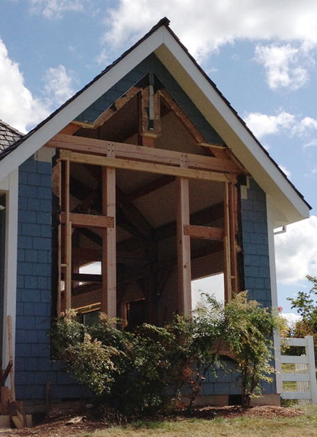 Last week New Energy Works Timberframers integrated new timbers for the updated fenestration on an Oregon home’s front fascia.