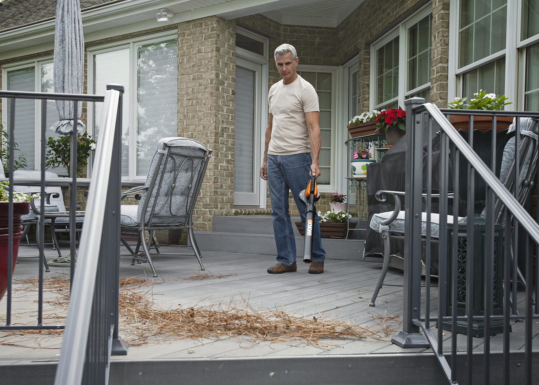 WORX AIR Blower/Sweeper clears porch of dirt and debris