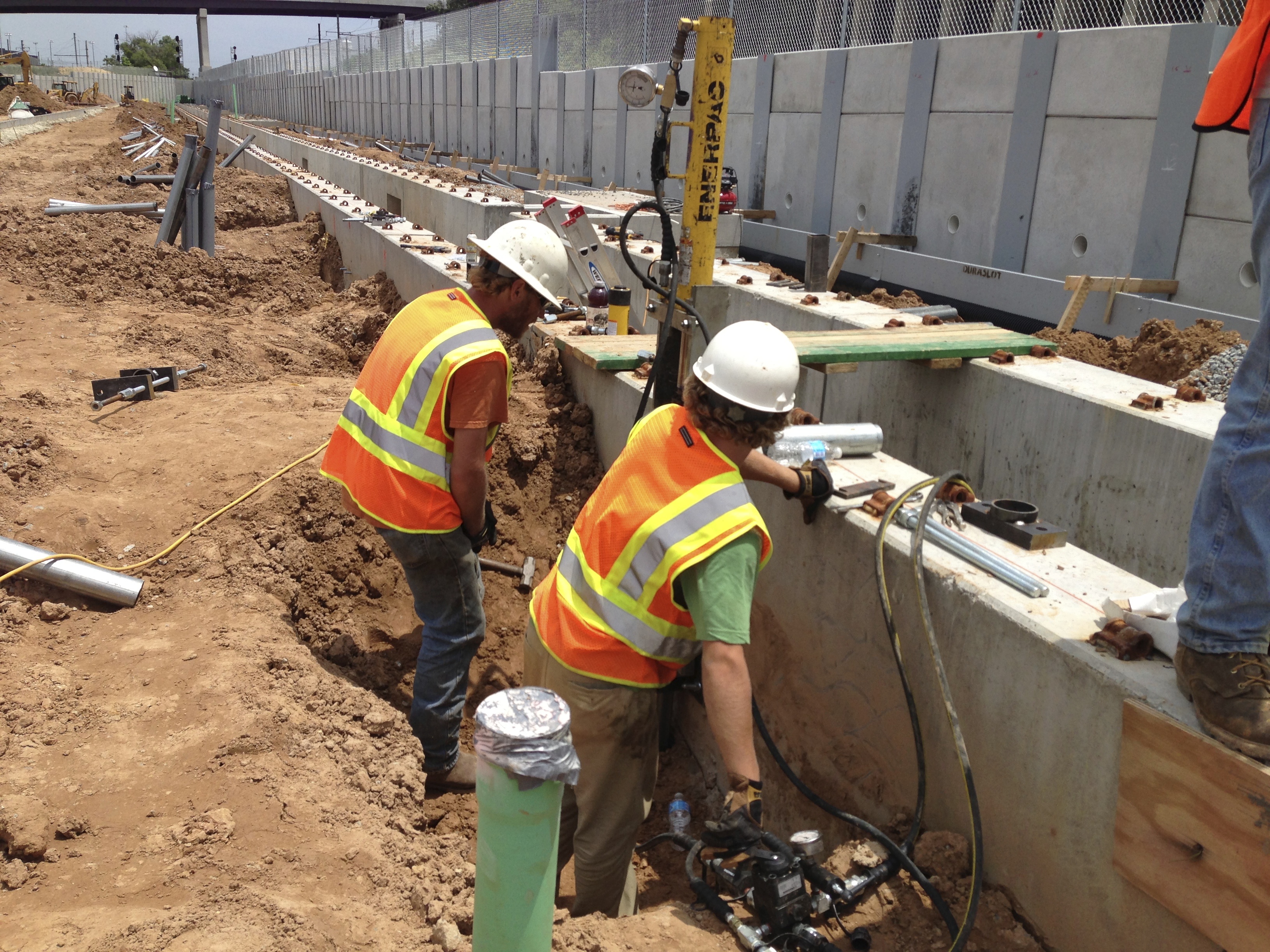 raising train inspection pits using foundation underpinning