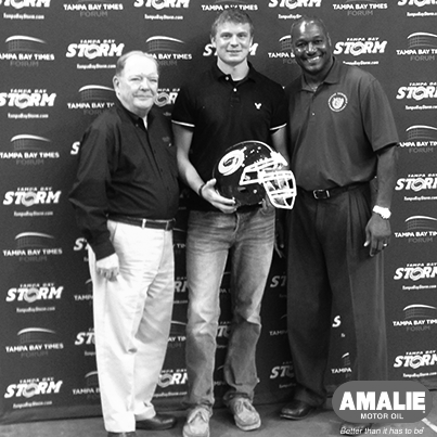 Tampa Bay Storm President, Derrick Brooks and Amalie Motor Oil Sr. Vice President of Global Sales & Marketing, Denny Madden, congratulate prize winner Ryan Hagler. Photo Credit:  Veronica Garcia