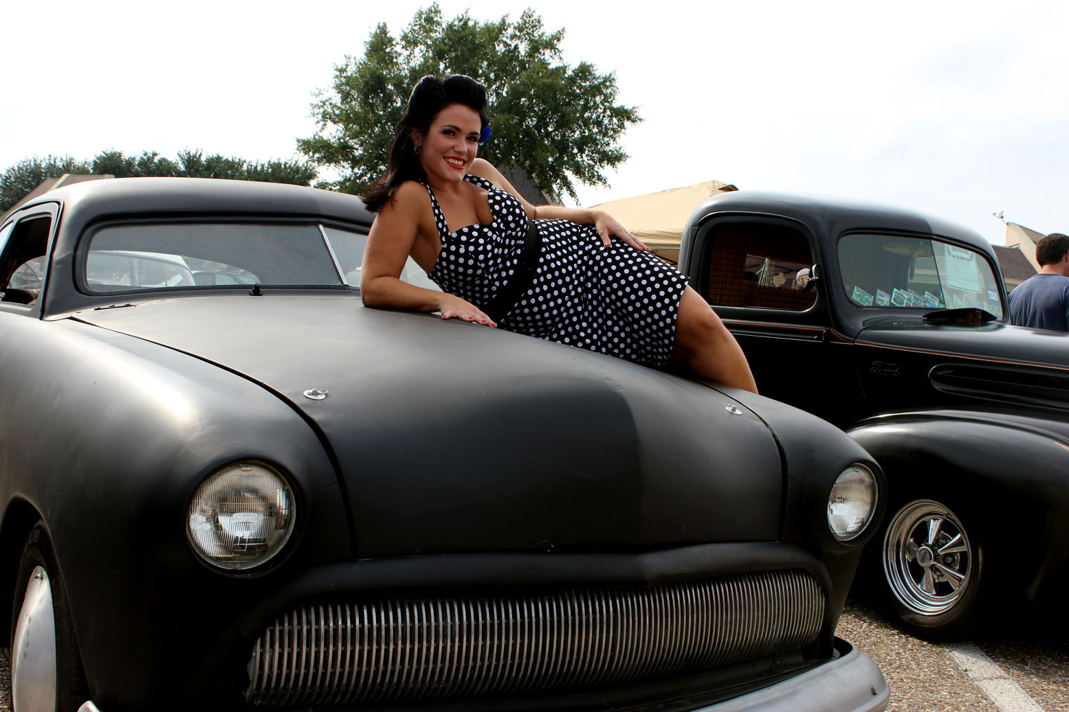 A guest at the Twin City Bomber Bash poses for a photo.