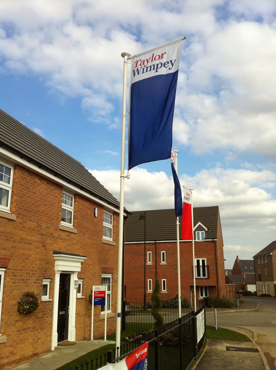 Taylor Wimpey Housing flags supplied by Harrison EDS
