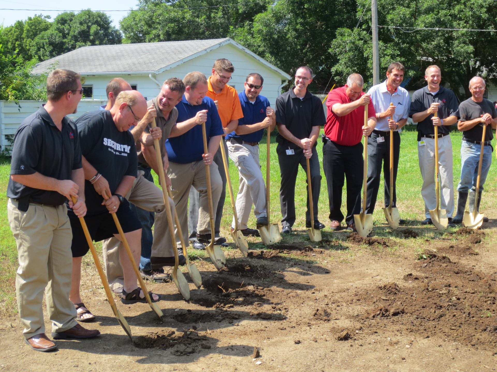 Representatives from Adams Thermal Systems, Habitat for Humanity and the Canton Ministerial Association break ground on a new house in Canton, SD