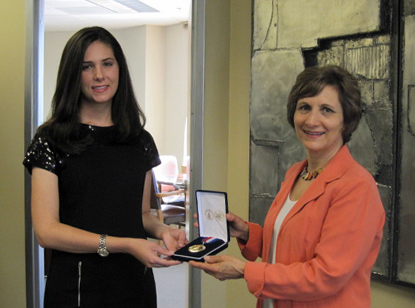 Alexandra Gritta of Portland, Oregon, is presented the Congressional Award Gold Medal by Congresswoman Suzanne Bonimici