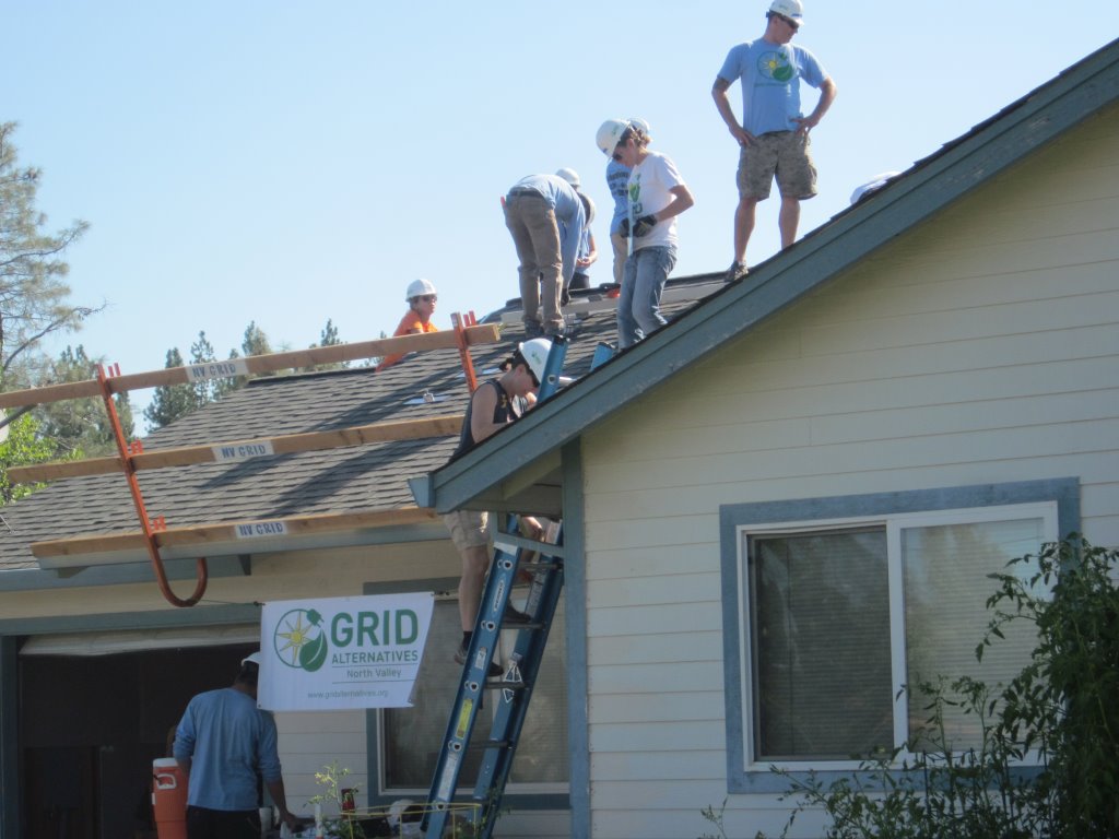 Sierra College faculty are guided by GRID Alternatives team as they install solar