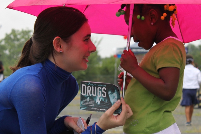 At National Night out August 6, 2013, a volunteer shared the truth about drugs with a young girl in Washington, D.C.