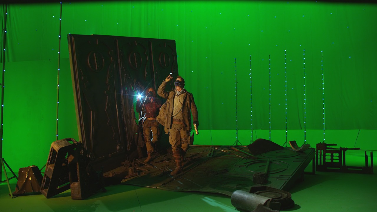 Actors work on green screen sets where the CG environments created for the show are later added.