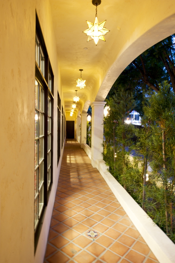 Among the Spanish Colonial Revival features of the new Los Feliz Mission are the exterior terra cotta and hand-painted tiling, decorative lighting and pillared archway.