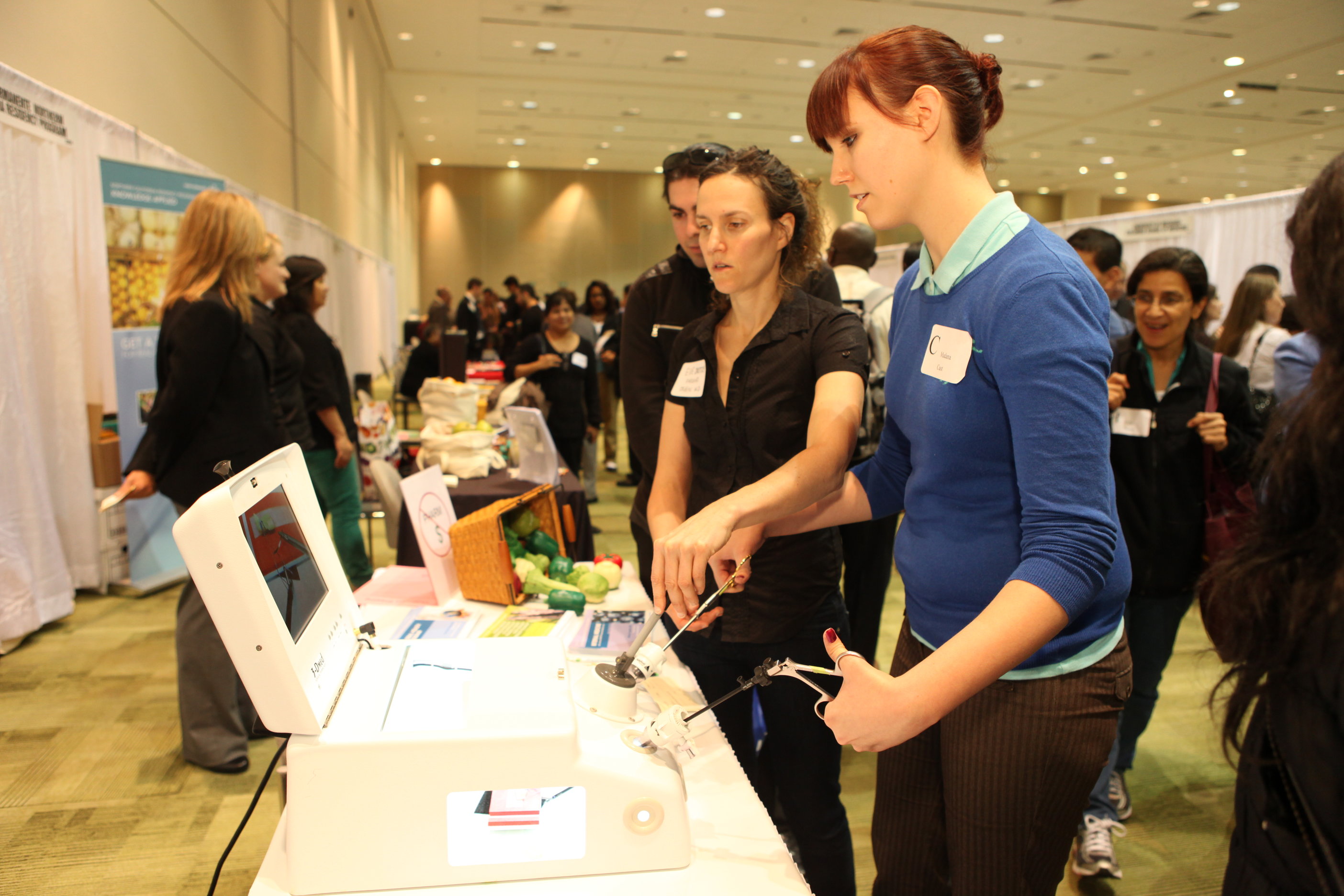 Kaiser Permanente Northern California hosts an interactive activity that allows students to demo a laparoscopic suturing simulator.