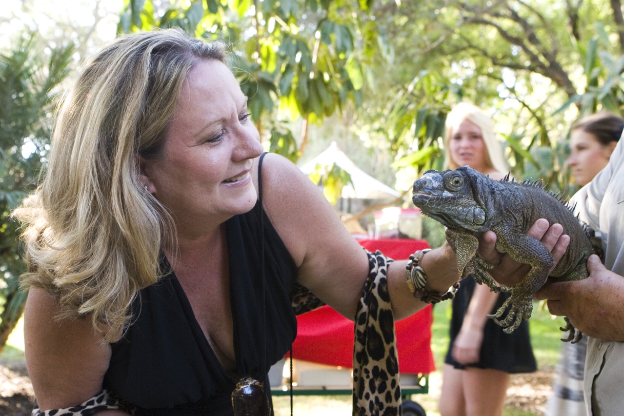 Board Member Patty McClendon with Lizzie the Iguana.  Photo by Ann Chatillon