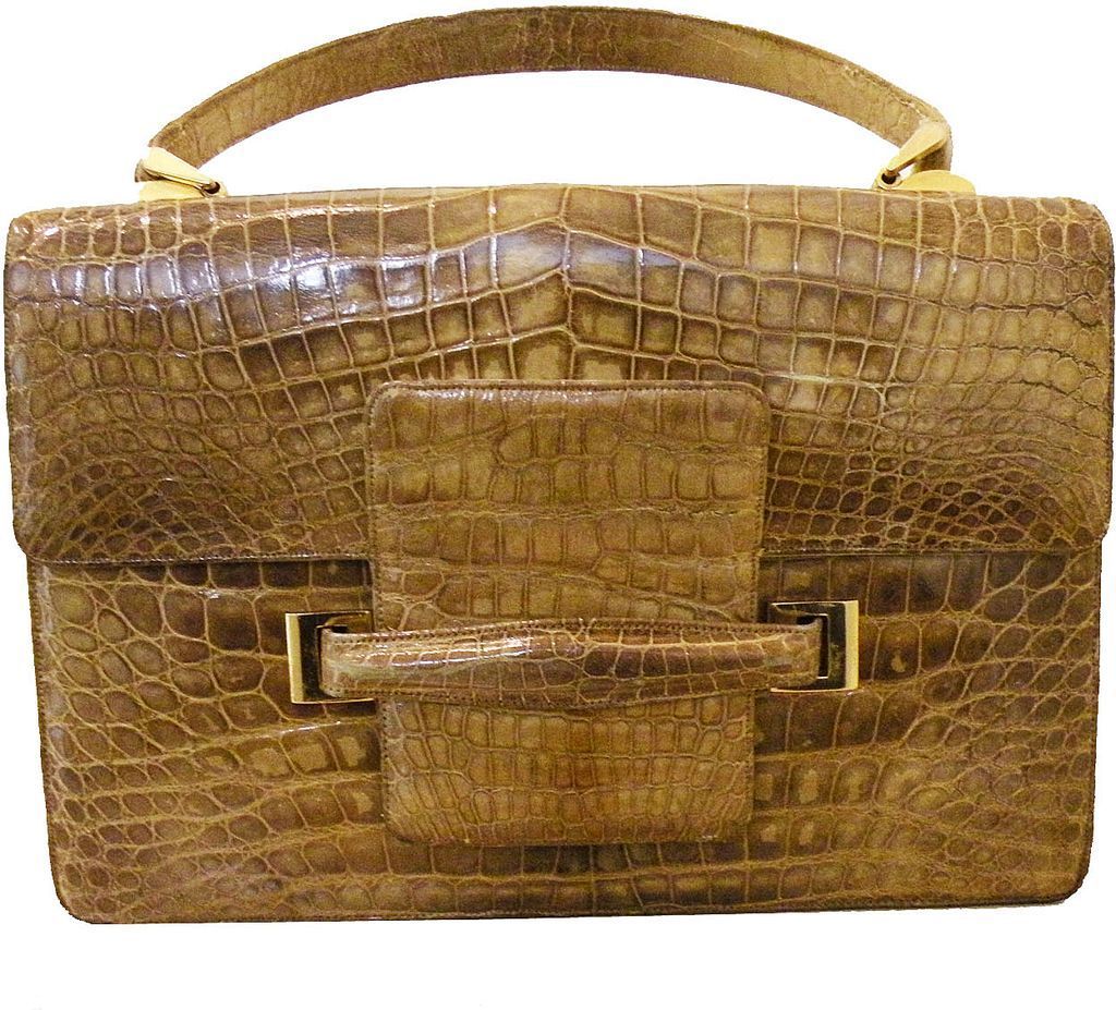 A blonde alligator purse. Made in France. Represented by The Purse Lady
