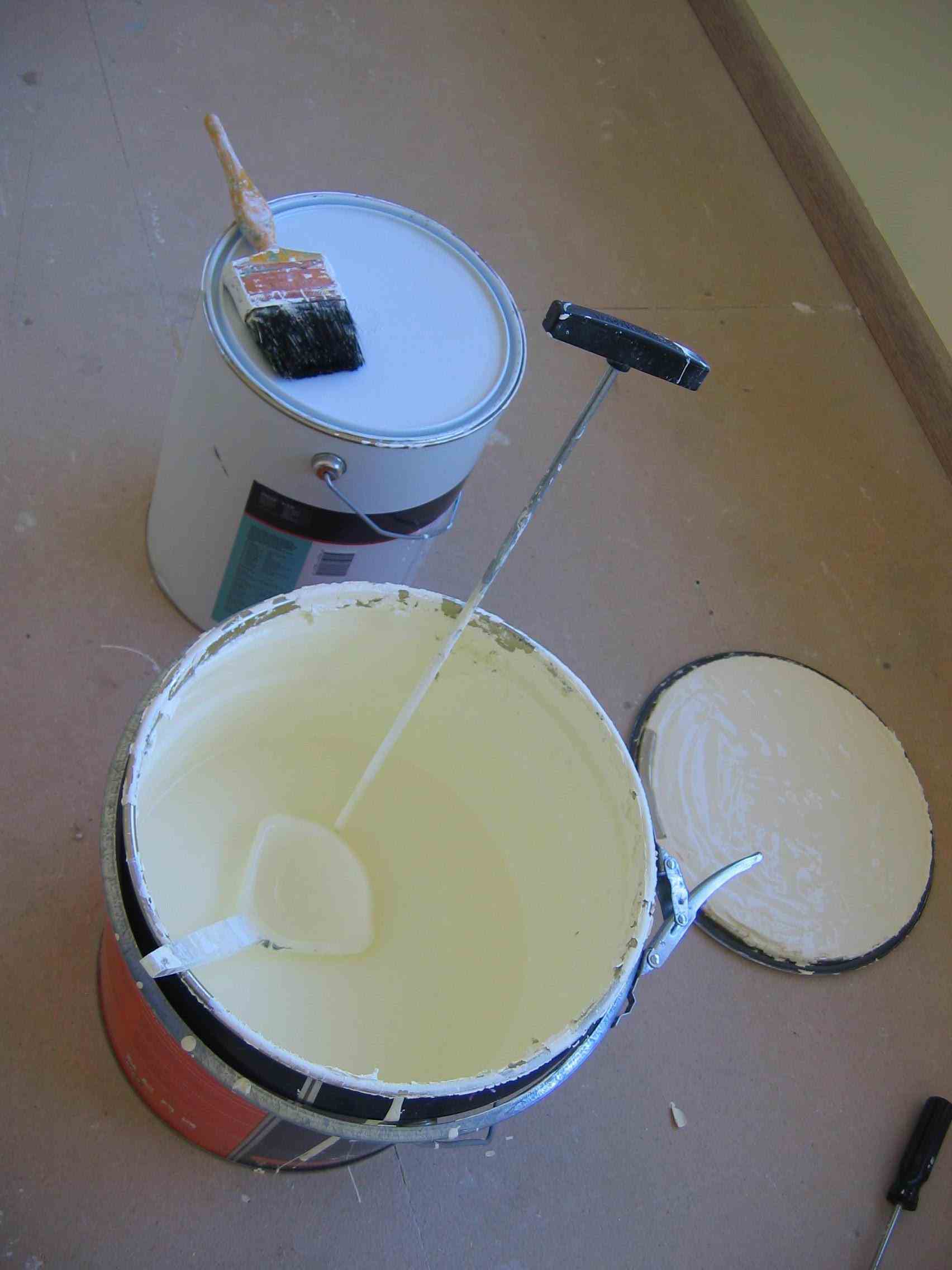 Solvent exposure is a hazard found in paint factories.