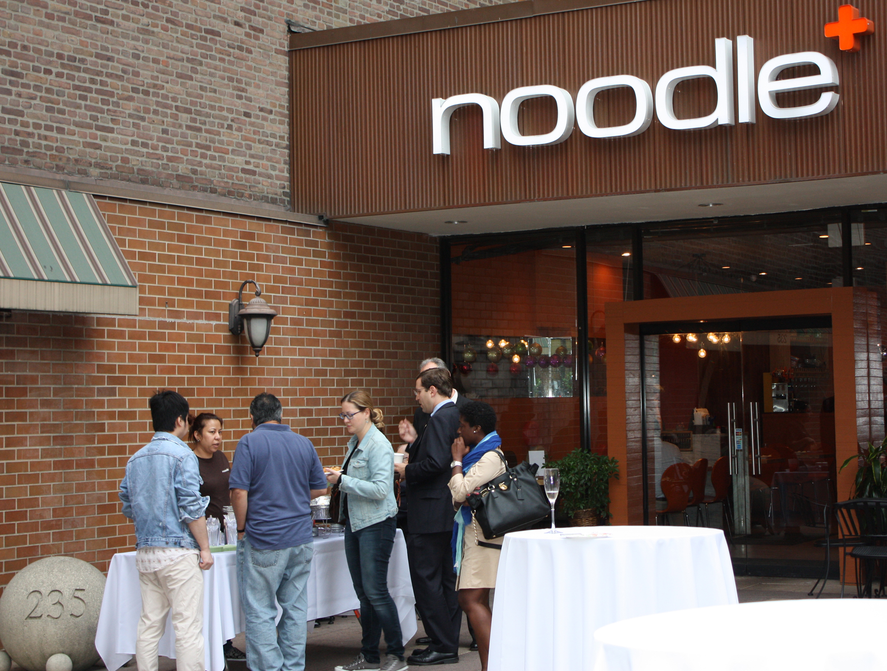 Visitors sample potstickers, dumplings, and noodle dishes from noodle + as they “Experience the Renaissance of White Plains” at a September 16 courtyard reception