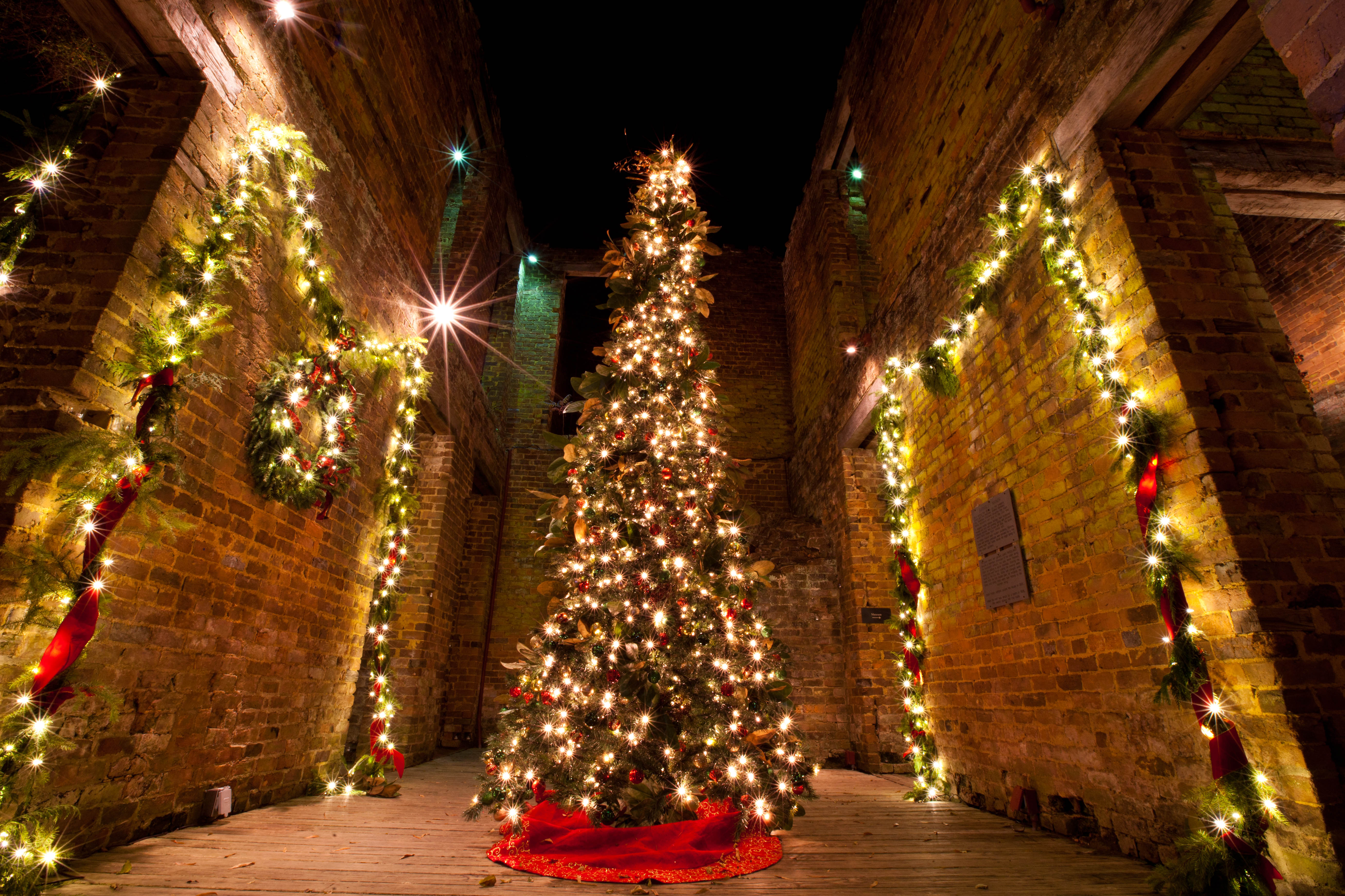 Colorful lights adorn the walls and Christmas tree inside The Ruins at Barnsley Resort.