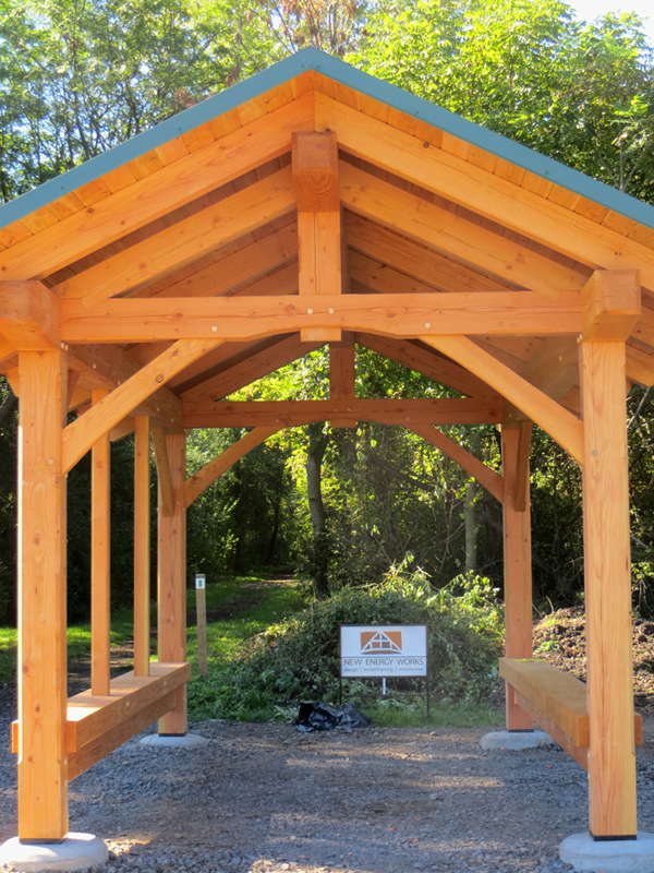 Using Douglas fir timbers, New Energy Works Timberframers crafted and raised the memorial pavilion at the trailhead of Ontario Pathways in Phelps, New York.