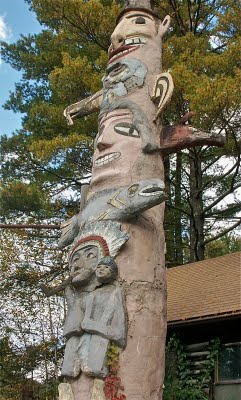 This totem pole, erected by Emile Brunel in 1933, depicts events in his life.