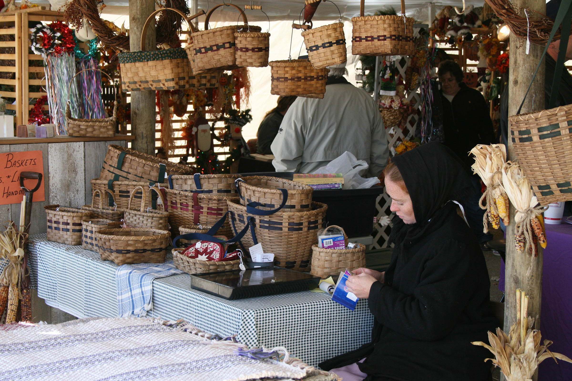 Amish basket weaver sells her wares at the Shipshewana Fall Crafters Fair