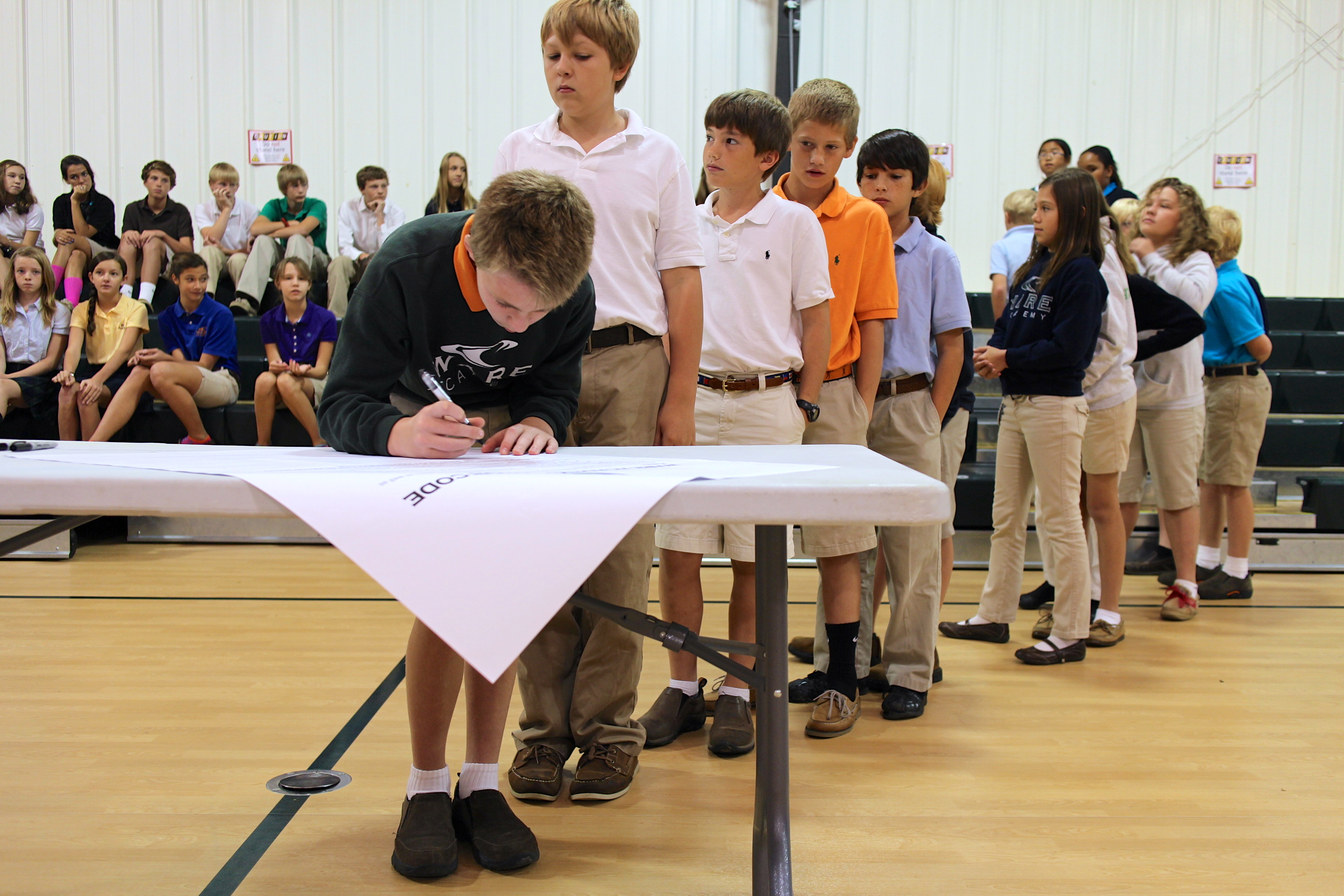 Ware Academy’s middle school students gathered Sept. 30 to sign the independent day school's honor code in front of witnesses.