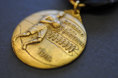 A 1914 gold-leafed basketball medallion used as an in-arena giveaway at the Manhattan Casino to promote the annual St. Christopher Club of Harlem vs. Howard University rivalry.