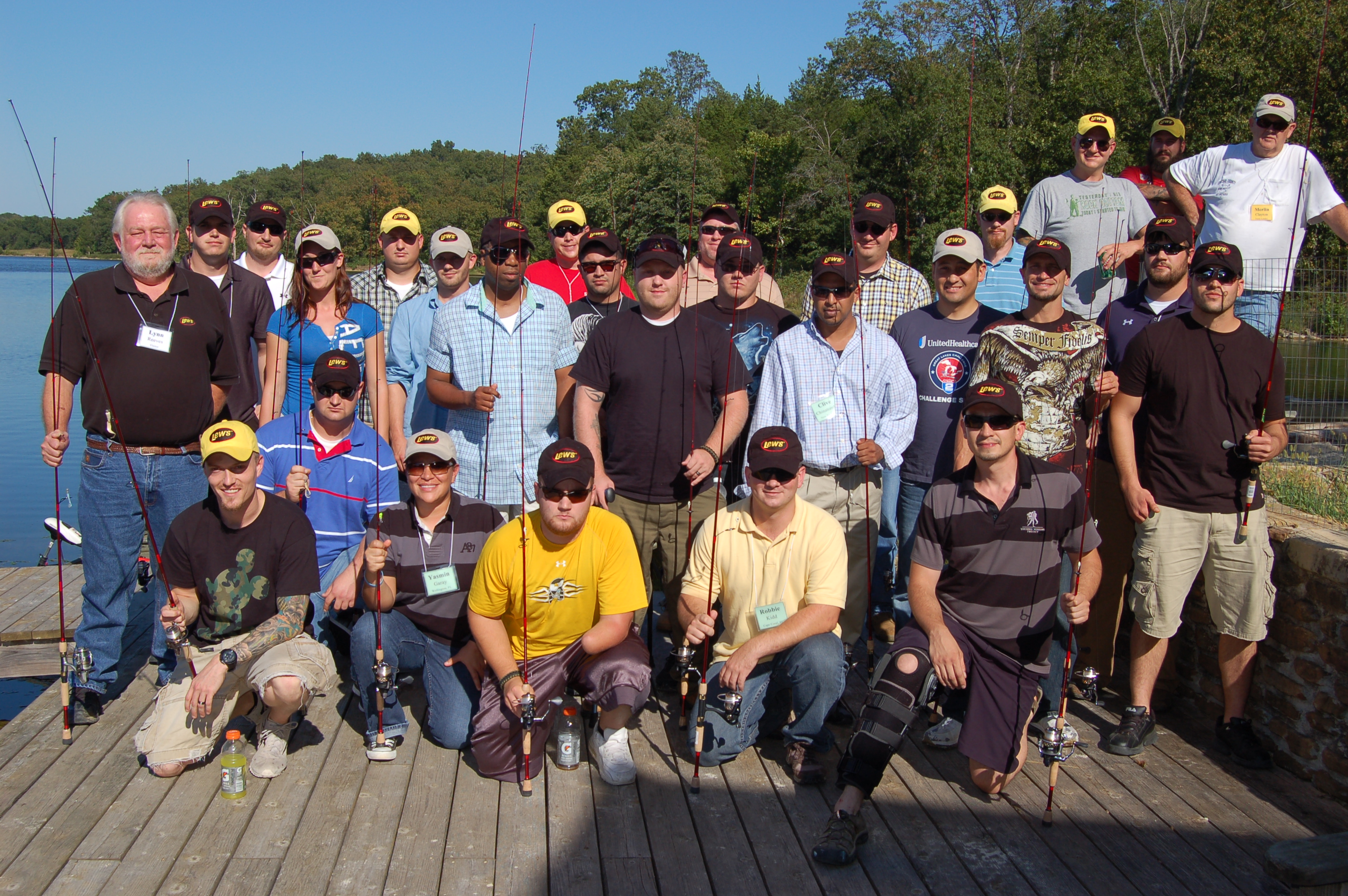 Lynn Reeves (standing left), Lew's CEO, joined the Sept. 2013 class of the FOCUS Marines Foundation near St. Louis, Mo., for their fishing activity.