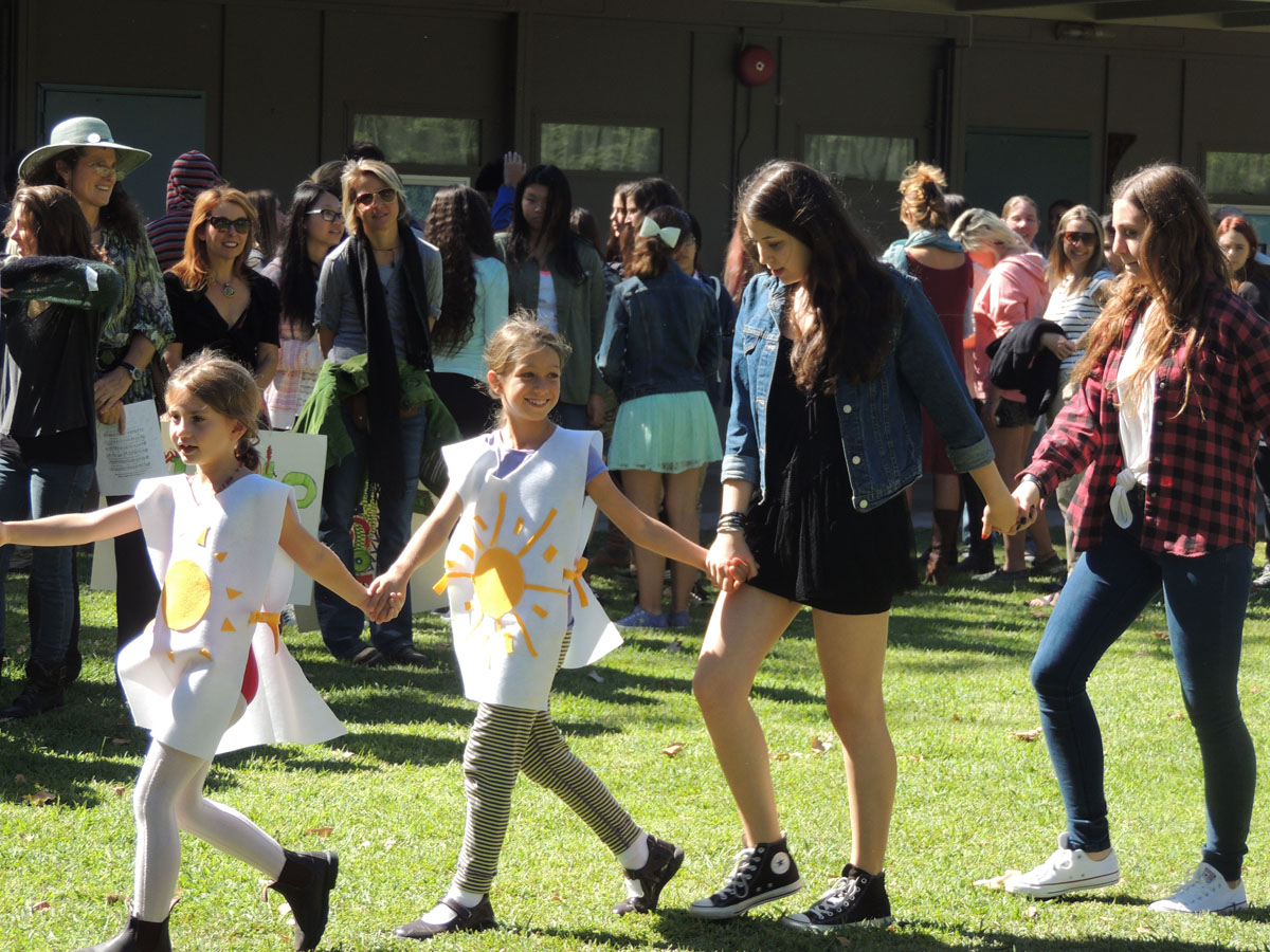 Highland Hall Waldorf School second grade and high school students participating in the school's Michaelmas celebration.