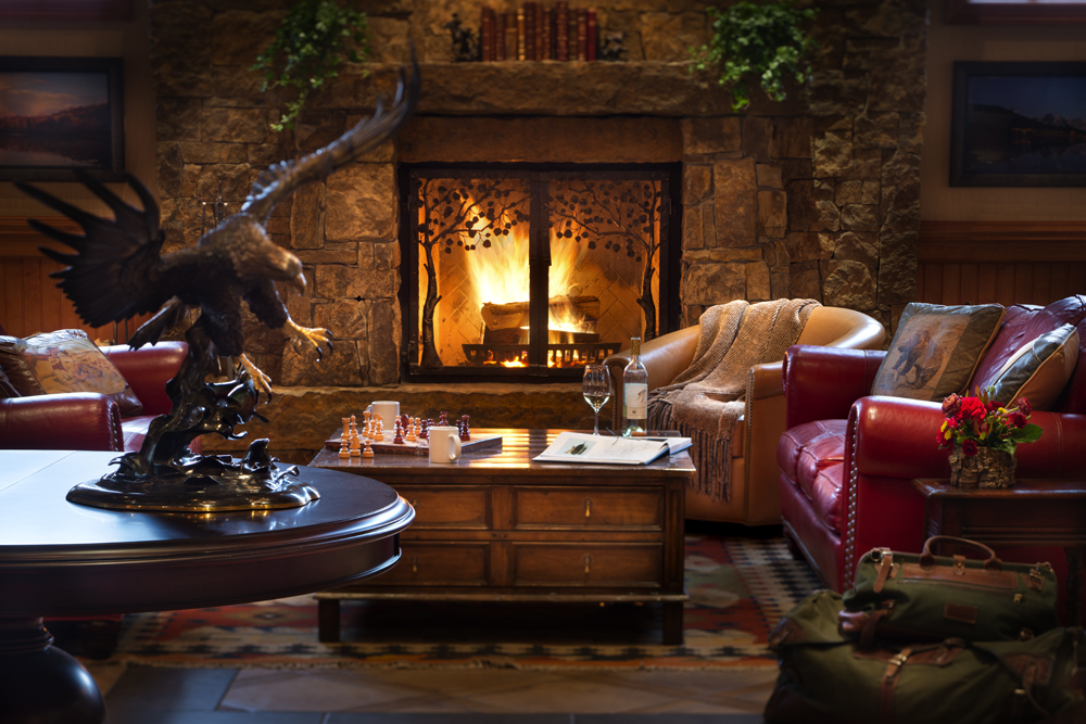 The lobby at the newly renovated Wyoming Inn delights with a warm fire for a relaxing après-ski experience (© Kevin Syms).