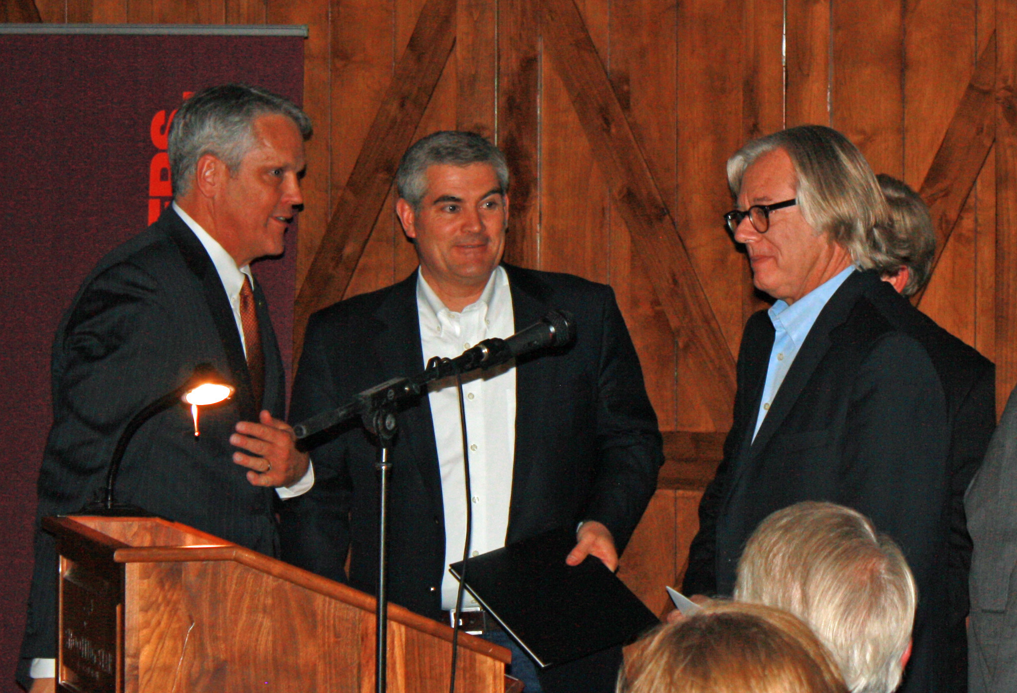 AIA WMR Senior Director Stuart Coppedge presents Mitch Blake and Tom Ward with AIA WMR’s 2013 Firm of the Year award at the Four Seasons in Jackson Hole on Friday. (© Galen Parke)