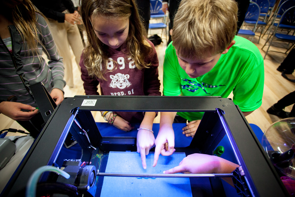 Students check out a 3D printer at Newtown Friends School in Bucks County, Pa. during the launch of a pilot program to support STEM education in U.S. schools.