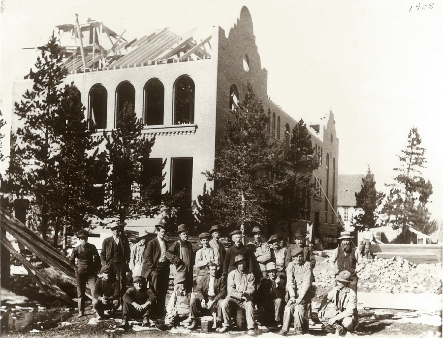 Construction crew poses for a photo in front of the school house in 1908.