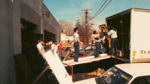 "Move-in Day" January 31, 1988. Staff and moving crew bring furniture into the new facility.