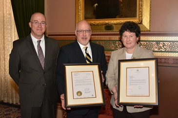 David Provost, Deputy Commissioner of Captive Insurance, Cassatt President and CEO Eric W. Dethlefs and DFR Commissioner Susan Donegan