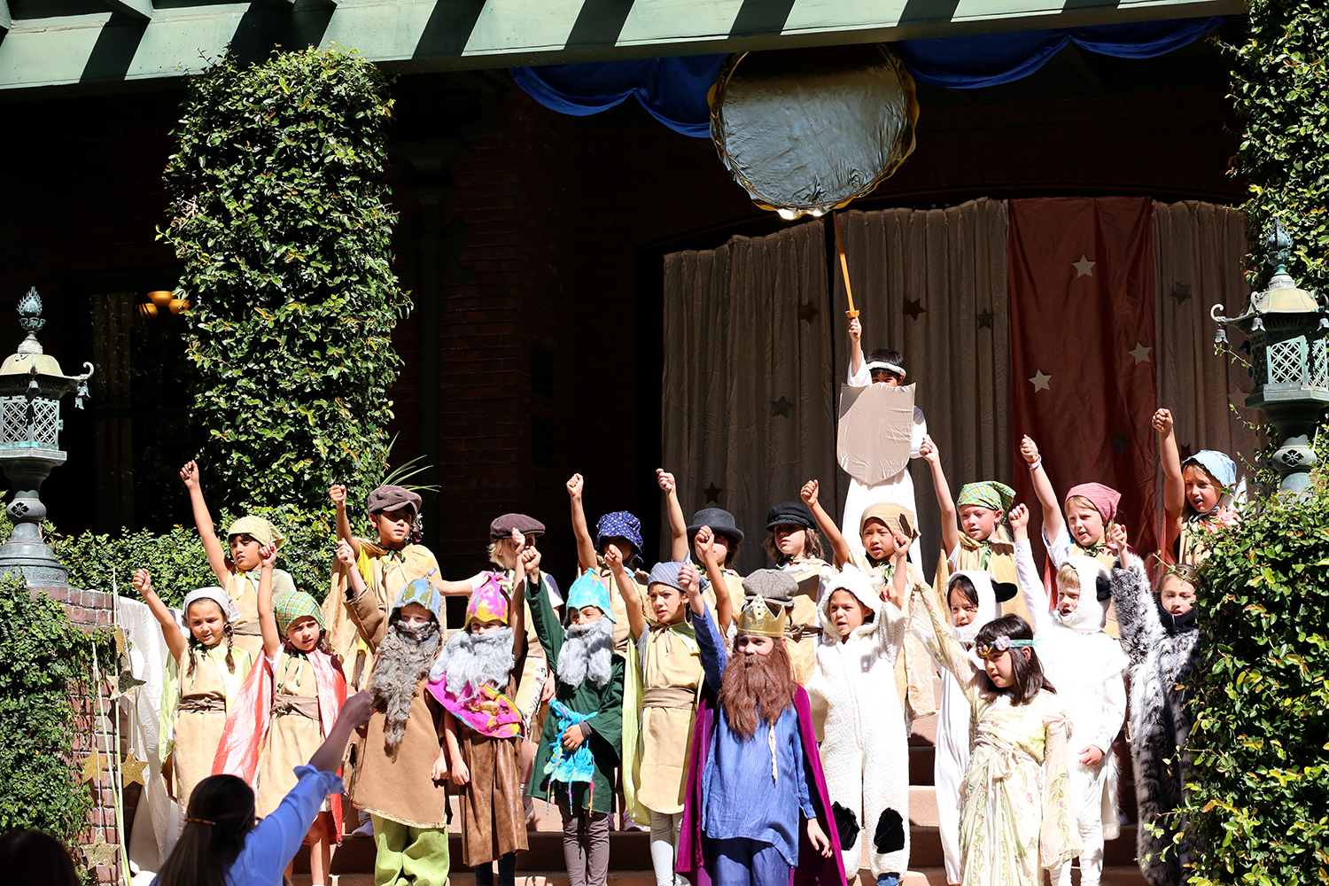 Villagers Triumphant! Second graders at Pasadena Waldorf School celebrate the Dragon's defeat.