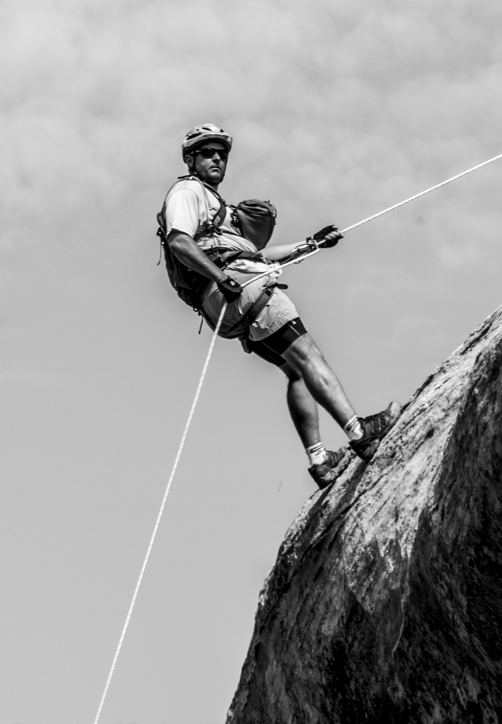 Van Brinson rappels off a sandstone cliff at the 2013 Adventure TEAM Challenge in western Colorado. Photograph by Brian Gliba.