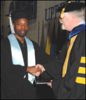Hunter receives diploma in 2012 from Upper Iowa Univ.
