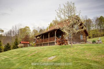 This privately-set Catskill Mountain log home is offered for $399,000 through Coldwell Banker Timberland Properties. Listing #34399. Call 845-586-3321