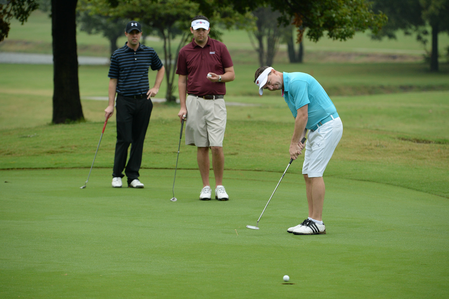 Nearly 180 golfers braved a persistent rain to participate.