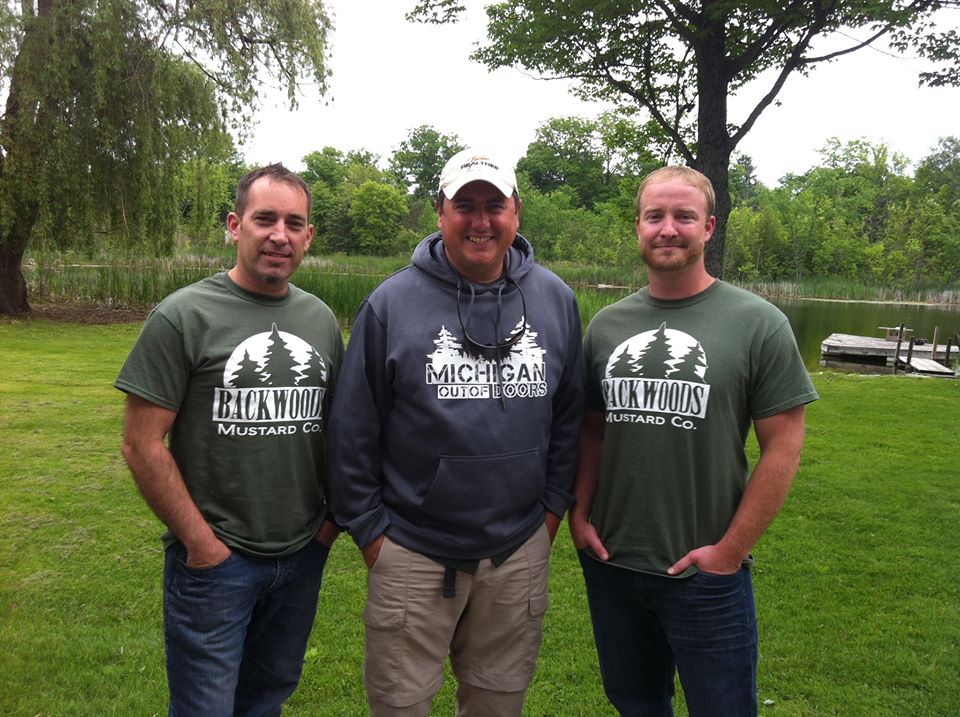Owners Brian Ernst and David Saterstad with Jimmy Gretzinger of Michigan Out-of-Doors