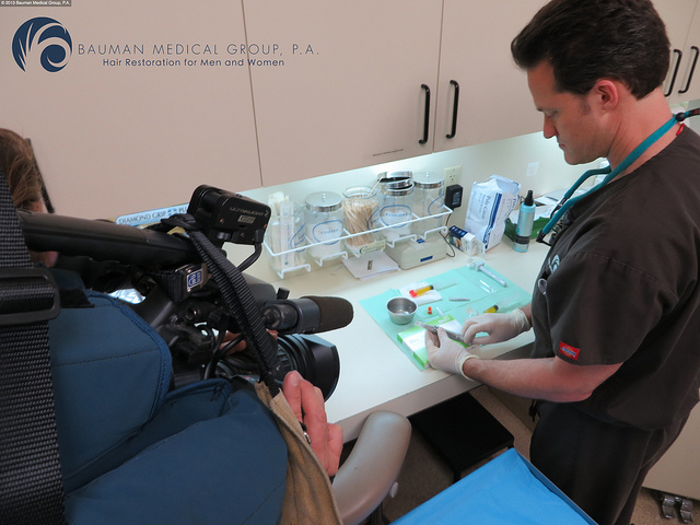 Dr. Alan Bauman prepares a "Vampire PRP" treatment for a patient