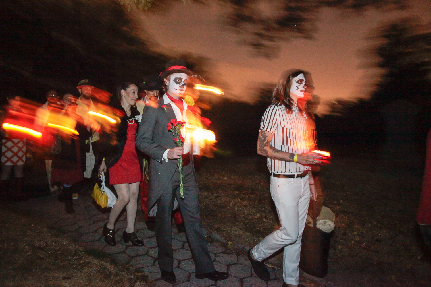 Day Of The Dead-dressed audience is guided to Act 1 of "Memento Mori" at Green-Wood Cemetery.