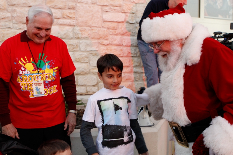 Santa Claus brings holiday cheer to the children and families