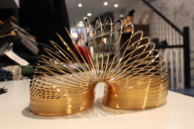 The gold-plated Slinky can climb down stairs with the best of them while outshining the beloved model from childhood.