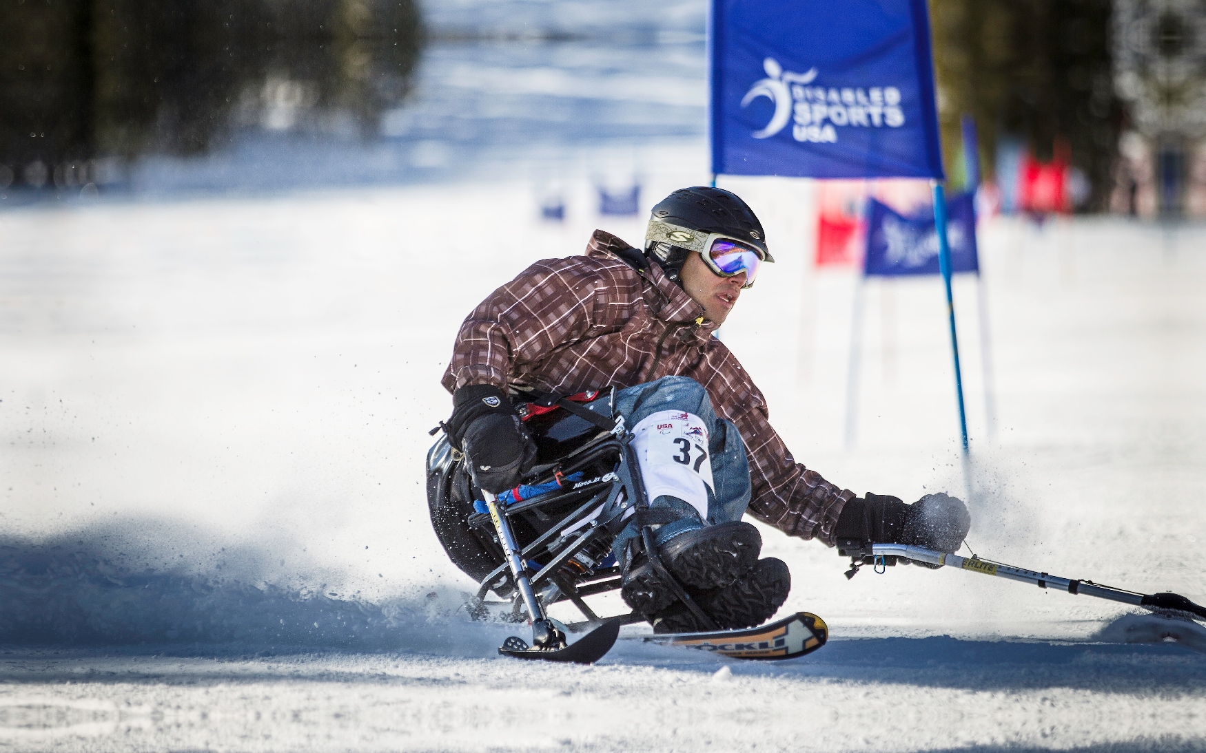 Wounded warrior Anthony R. mono-skiing at The Hartford Ski Spectacular
