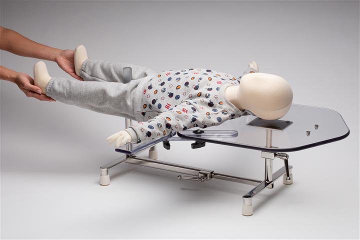 Pediatric Spica Table in use with Arm Supports