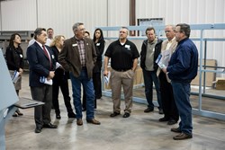 DMS CEO, Patrick Bollar gives a manufacturing floor tour to a group including County Commissioner, Dennis Hisey and James Irwin Charter Schools CEO, Jonathan Berg
