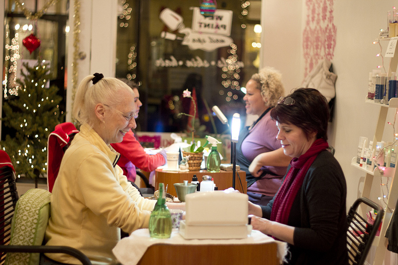 Happy patrons at Wet Paint Nail Spa during 2012 Holiday Stroll